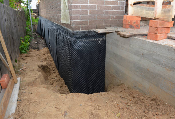 SJ Waterproofing Pros technician performing targeted Crawl Space Encapsulation assessment in Jacksons Gap, AL